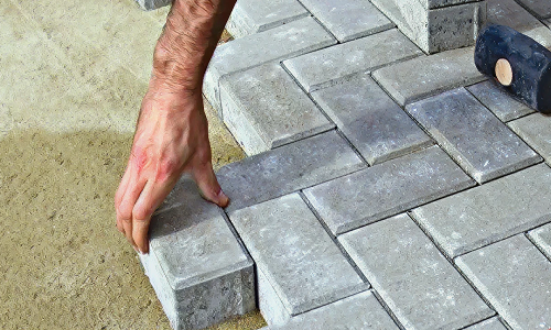 Laying Firth concrete pavers 