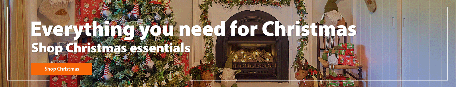 A heading 'Everything you need for Christmas, shop Christmas essentials' accompanied by an outdoor area with an outdoor table, Christmas tree & decor, BBQ and presents under the tree