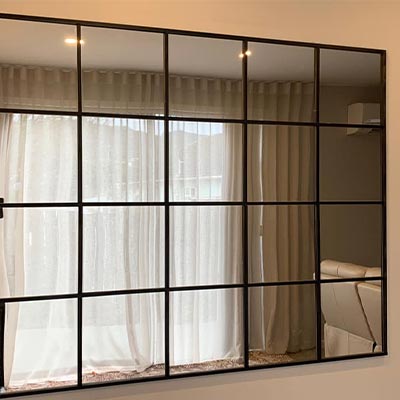 Mirror displayed in hallway of home