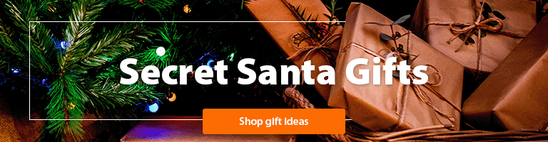 A photo of a Christmas tree with presents underneath with a "Secret Santa Gifts, shop now" heading 