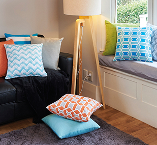 Stacks of cushion and decorative pillows