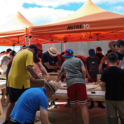 Big Buddy group building rat traps under Mitre 10 tents for Rotoroa Island.