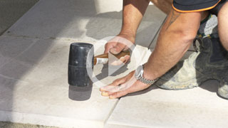 How to lay concrete pavers on sand
