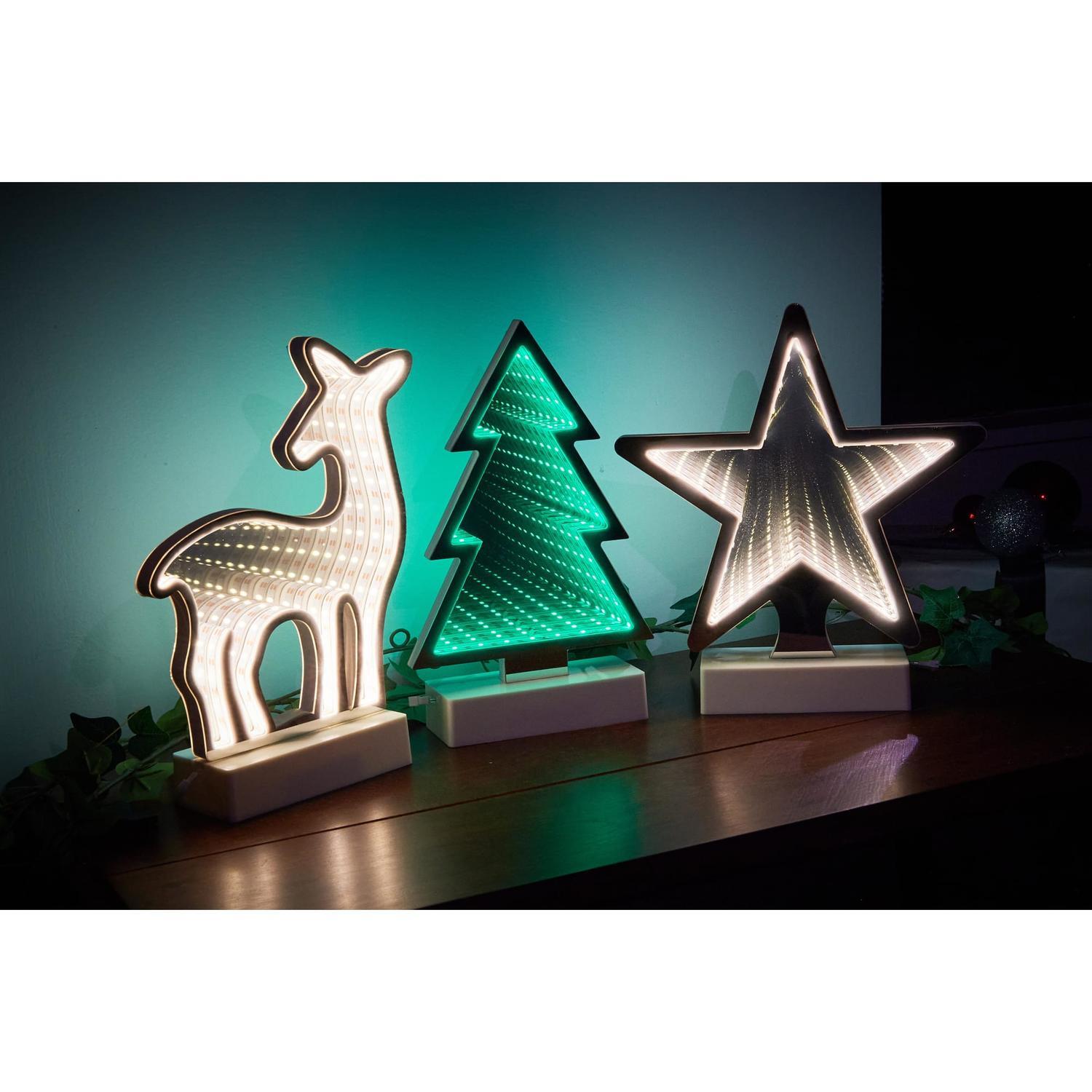 Infinity Table Lights. Design available: Reindeer, Star, and Tree Reindeer H: 25cm, L: 18.5cm; Star H: 25cm, L: 22cm; Tree H: 25cm, L: 15.5cm / Battery Warm White (Reindeer and Star), Green (Tree)